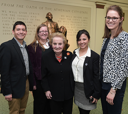 Madeleine Albright posing for a picture with some students Madeleine Albright posing for a picture with some students