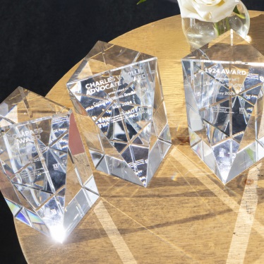 Photo of three glass awards on a table