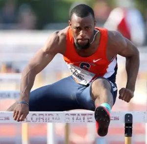 Freddie jumps a hurdle in a race.