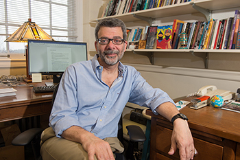 Anthropologist John Burdick in his office in Maxwell Anthropologist John Burdick in his office in Maxwell