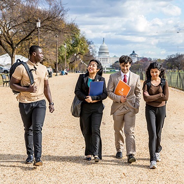 Four Maxwell-in-DC students in front of the Capitol.