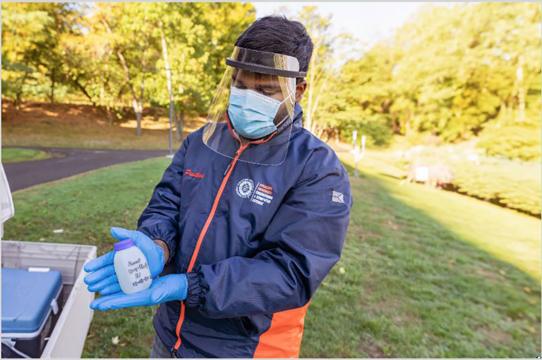Pruthvi Kilaru taking wastewater samples