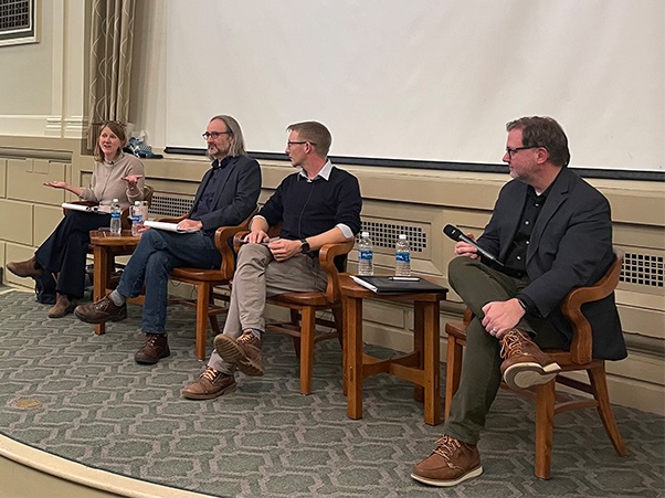 A panel of experts speak in the Maxwell Auditorium